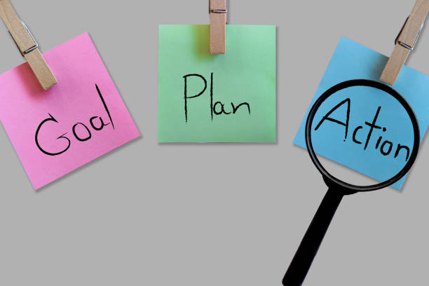 istock business goal plan action word on sticky note with magnifying glass 1202244642