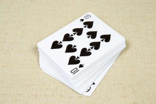 Face-up standard deck of playing cards on textile surface