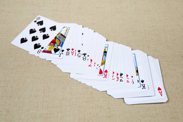 istock Shifted deck of playing cards on the cloth surface 1202244847