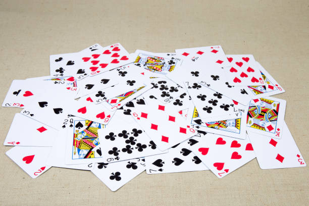 istock French playing cards scattered face-up on the cloth surface 1202244951