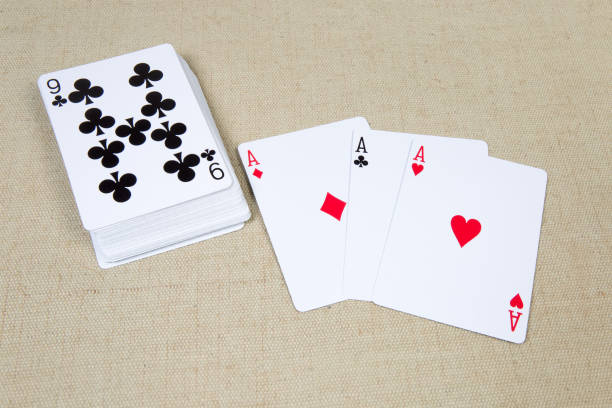 istock Playing cards of aces and deck playing cards face-up 1202244992