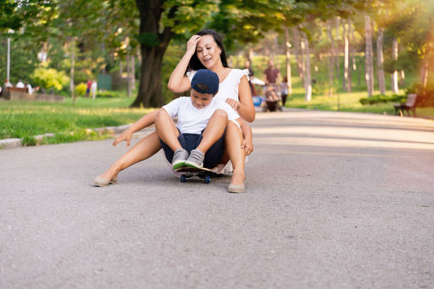 istock Mom and son in park having fun 1202246327