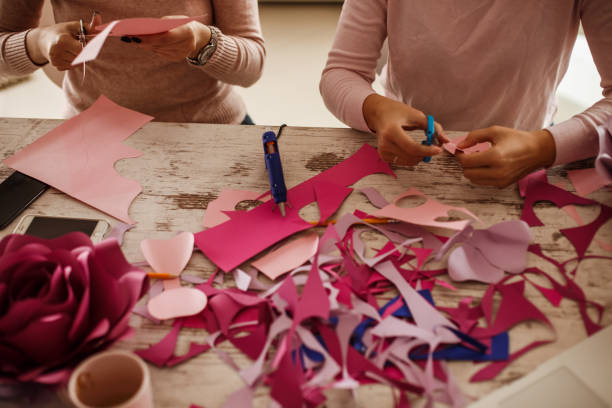 istock Cutting up petals to make decorative paper flowers 1202246595