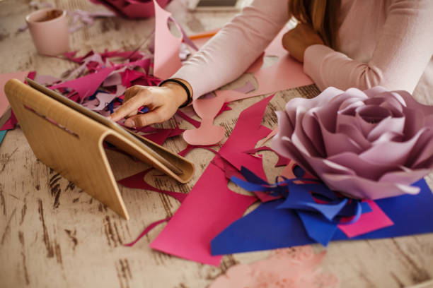 istock Looking for inspiration while crafting paper flowers 1202246596