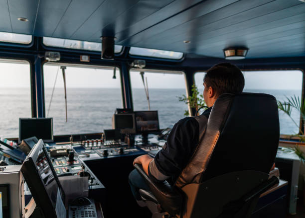 istock Marine navigational officer during navigational watch on Bridge . Work at sea 1202247295