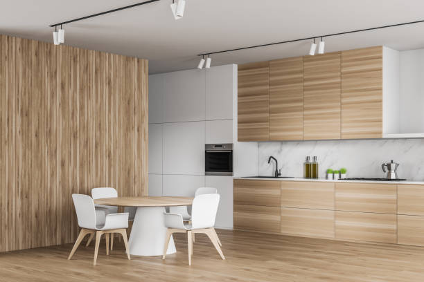 istock White and wooden kitchen corner with round table 1202248471