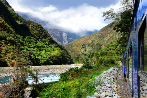 istock Peruvian train to Machu Picchu passes along the Urubamba River 1202248733
