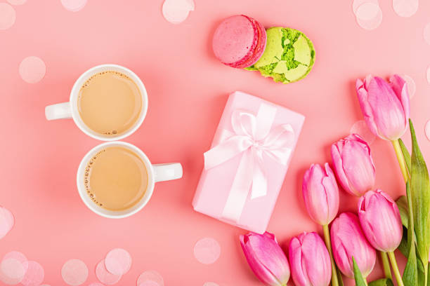 istock View from above tulips and gift box with confetti and copy space. Background for womens day, 8 March Valentines day, 14 february. Flat lay style, top view, mockup, template, overhead. Greeting card 1202248881