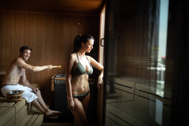 istock Couple enjoying finnish sauna during their spa weekend 1202249641