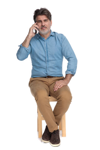 istock Bothered casual man talking on his phone and disagreeing 1202249695