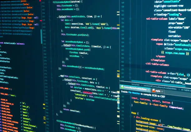 Photo of Program code Javascript, PHP, HTML, CSS of site. Web development. Programmer workflow. Source code script