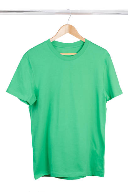 istock Blank green t-shirt on hanger isolated on white background 1202250626