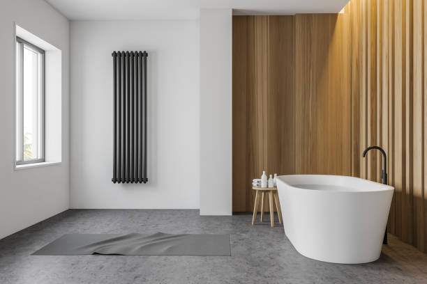 istock White and wooden bathroom with tub, side view 1202250670