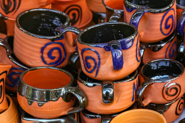 istock Handmade clay tea cups on display for sale at a handicraft fare 1202251637