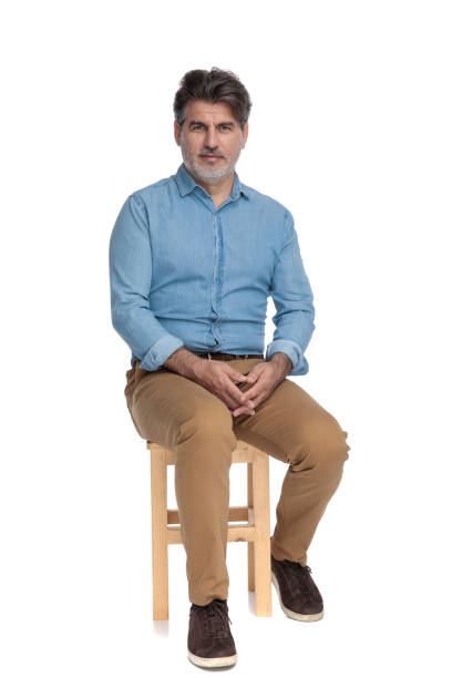 istock Bothered casual man looking forward and holding his hands together 1202255436