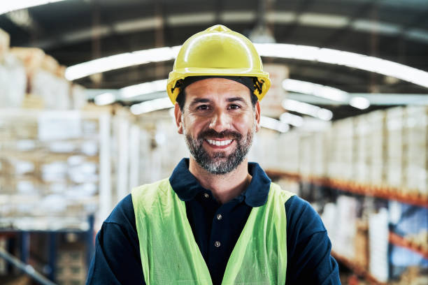 istock Portrait of smiling mature worker at warehouse 1202255455