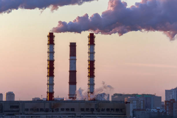 istock factory pipes smoke steam close-up. environmental pollution 1202256076