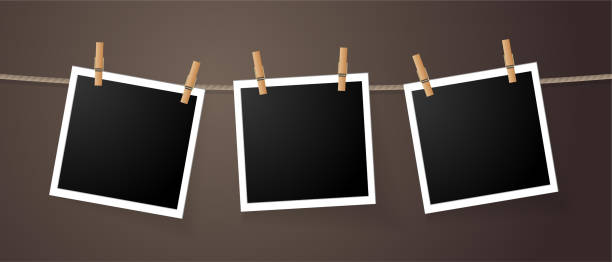 Photo frames Realistic detailed photo icon design template. Photo frames hanging on the rope with clothespines clothesline photos stock illustrations
