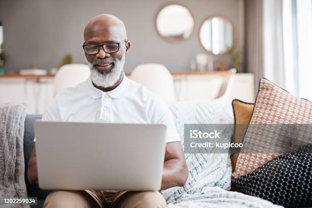 Technology Hosts Entertainment For All Ages Stock Photo - Download Image Now - Laptop, Senior Adult, Using Computer
