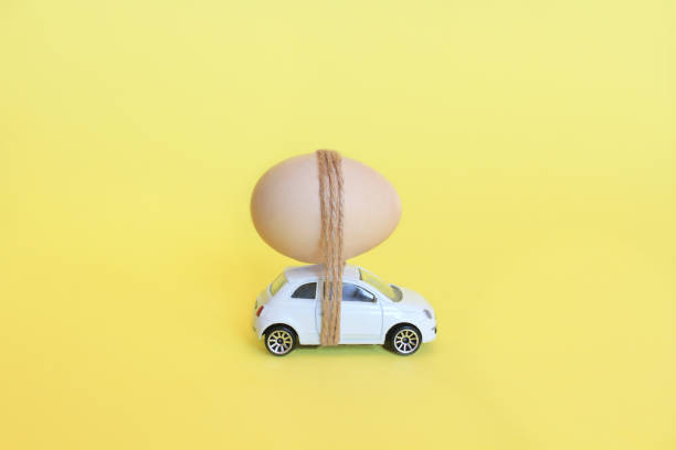 istock Close up of easter egg tied with strings on car abstract 1202261934