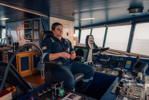 istock Marine navigational officer during navigational watch on Bridge . Work at sea 1202262885