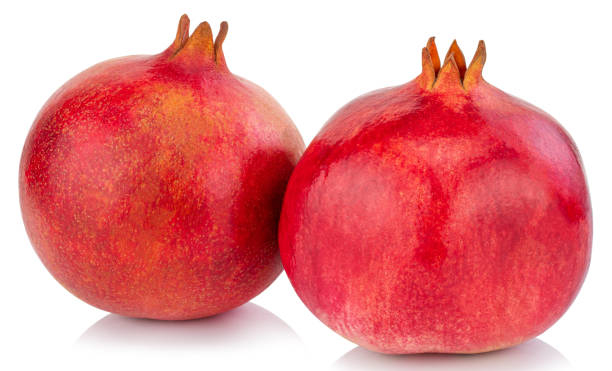 istock pomegranate isolated on white background with Clipping Path 1202263394