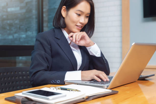 istock Business woman working with calculator in cafe. 1202263555