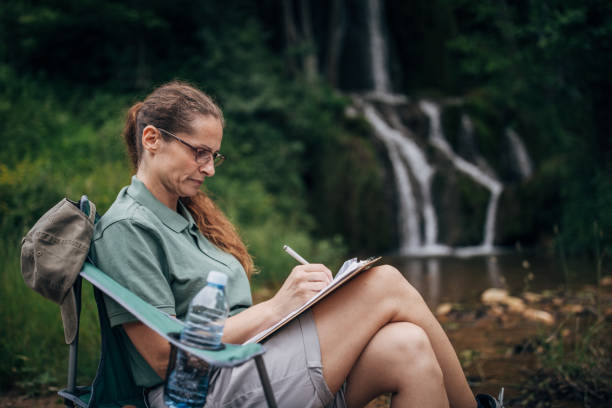 istock Female biologist taking notes in nature 1202264450