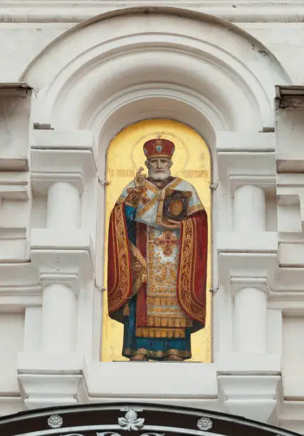 Tyarlevo, Pavlovsk, SAINT PETERSBURG, RUSSIA - september 11, 2019: golden icon of st Nicholas at entrance to St Nicholas' Cathedral, architect Alexander von Hohen, built in 1904