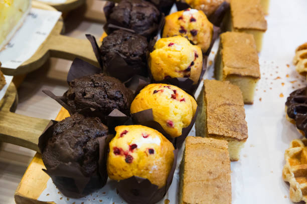 istock Berry muffins and chocolate muffins 1202268366