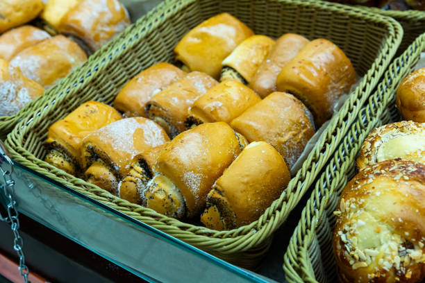 istock Fresh bake cinnamon roll with custard on a store counter. Traditional Russian pastries 1202268418