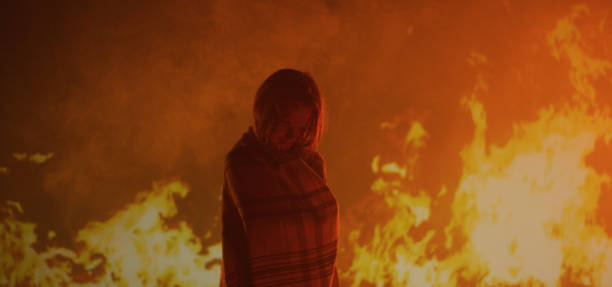 istock Girl trapped in fire crying 1202269260