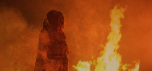 istock Girl trapped in fire crying 1202269354