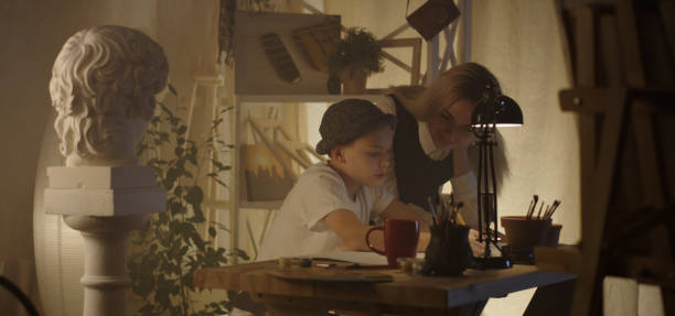 istock Teacher and student in art class 1202269385