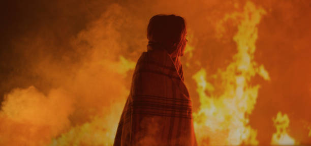 istock Girl trapped in fire crying for help 1202269435