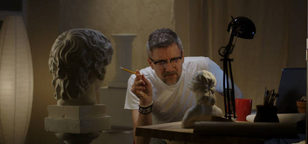 istock Artist talking to sculpture 1202269509