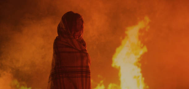 istock Girl trapped in fire crying 1202269511