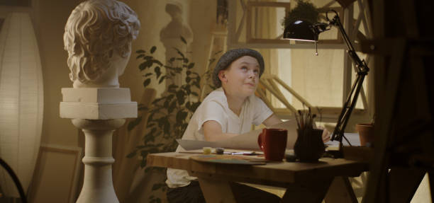 istock Young artist drawing at table 1202269591