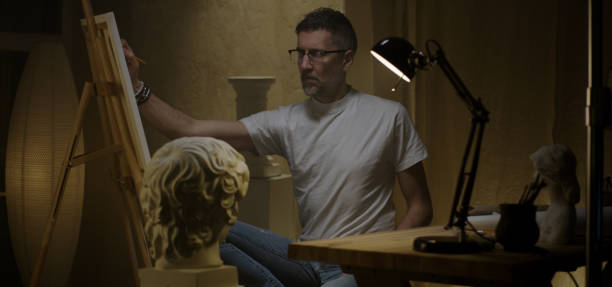 istock Artist painting in his studio 1202269624