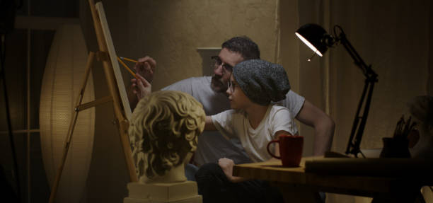Father and son studying sculpture