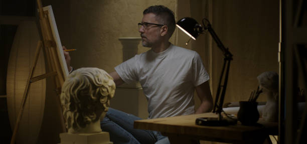 istock Artist painting in his studio 1202269674