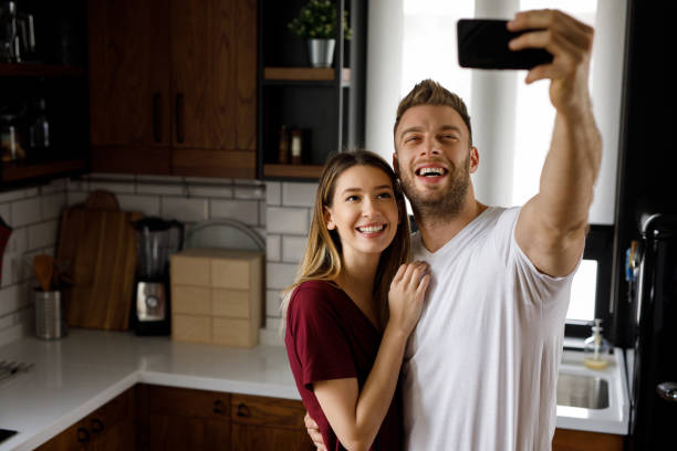 istock Couple taking a Selfie together in the kitchen during breakfast 1202270872