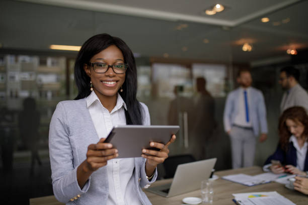 istock Young businesswoman using digital tablet in the office 1202271136