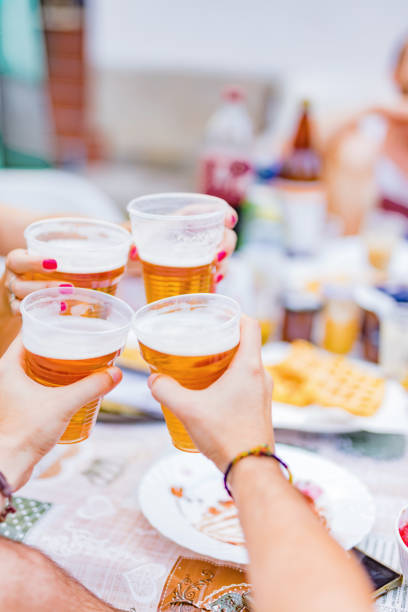 istock Friends enjoying drinking beer in the backyard. 1202273046