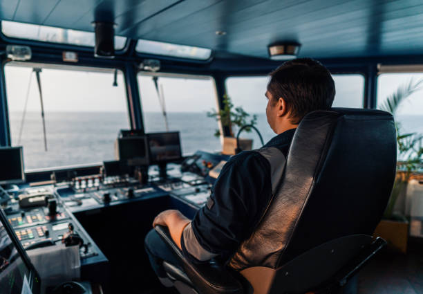 istock Marine navigational officer during navigational watch on Bridge . Work at sea 1202273070