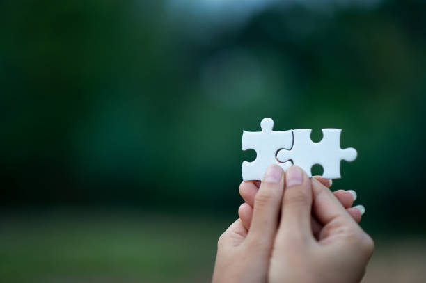 istock Hands and puzzles, important pieces of teamwork Teamwork concept 1202273109