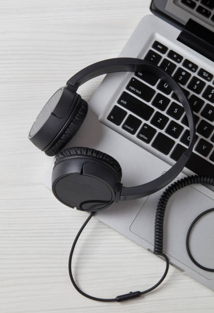 istock Headphones on laptop close-up 1202274097