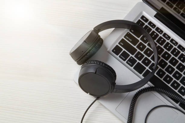 istock Headphones on laptop 1202274142