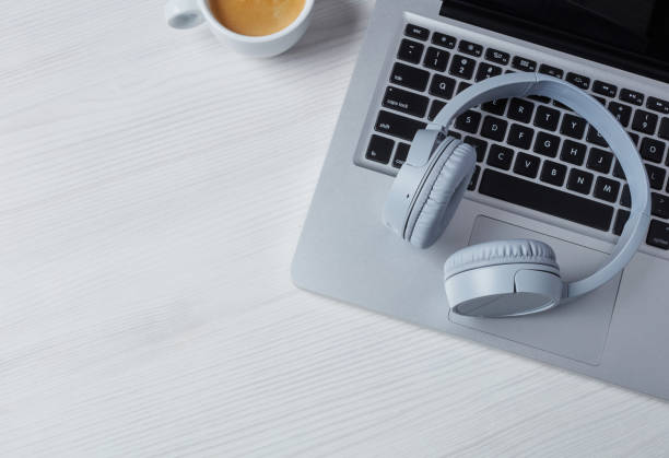 istock Headphones, laptop and coffee 1202274152