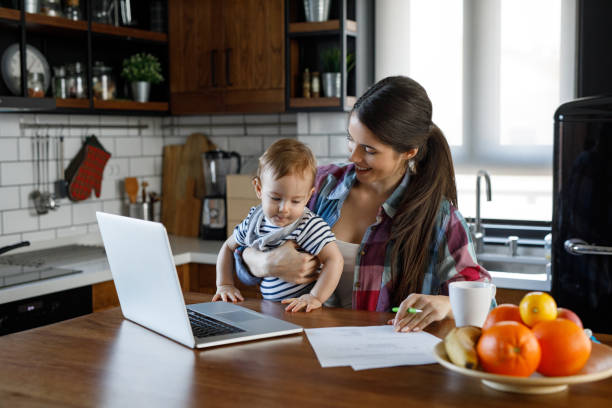 istock Young mother juggling work and child care 1202275461